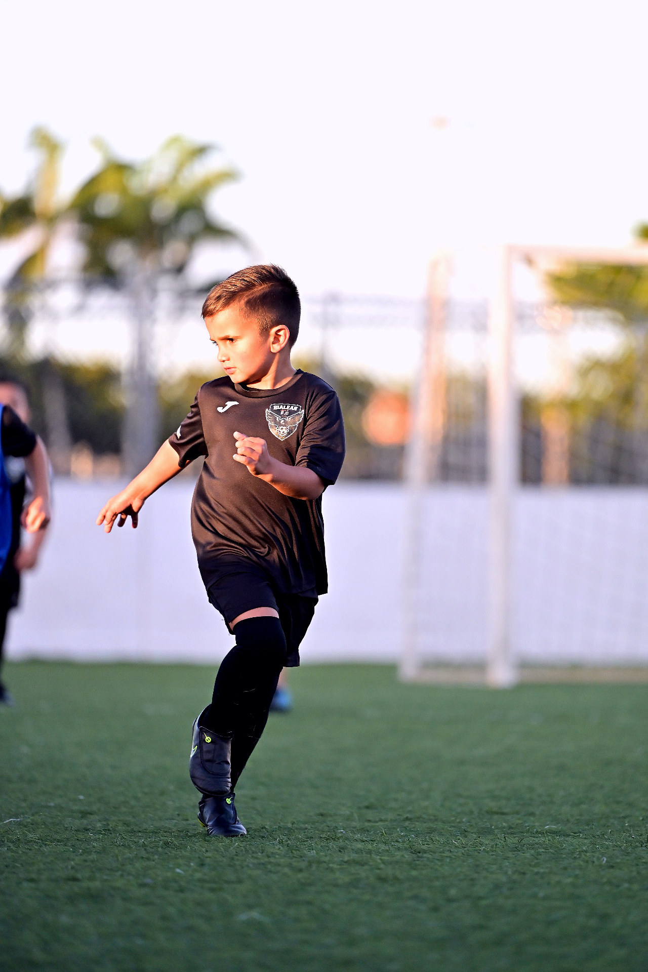 Hialeah City youth player running during training.